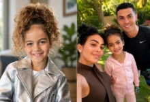 Alana Martina smiling with her parents Cristiano Ronaldo and Georgina Rodríguez during a family celebration.